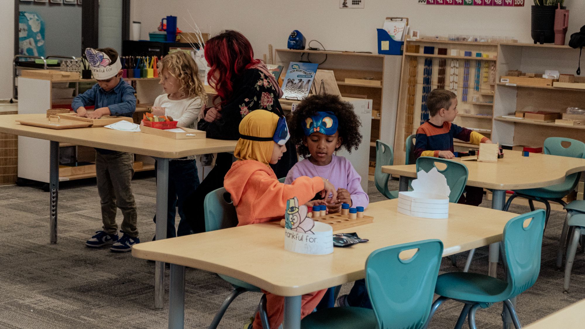 Wide shot of kindergarten classroom with counting and play activities